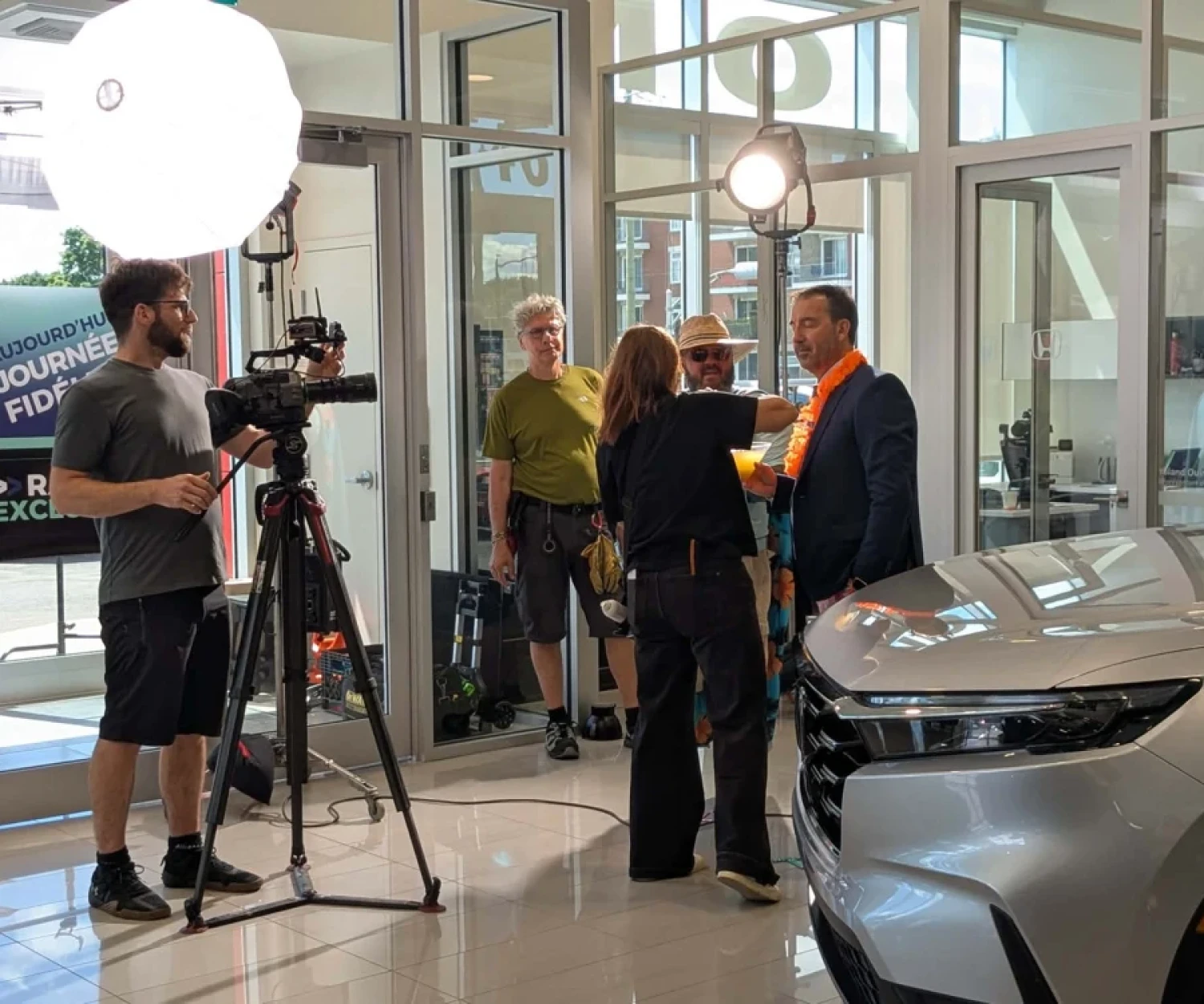 The Productions Optimales filming crew for Fidgi in a Honda dealership