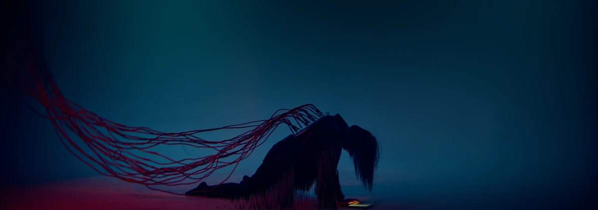 Image du vidéoclip Wicked Signal : silhouette reliée à des fils rouges, lumière bleutée